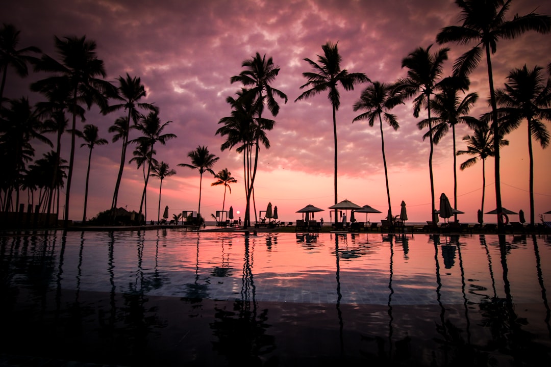 Sunset view of a luxury private bungalow over the lagoon